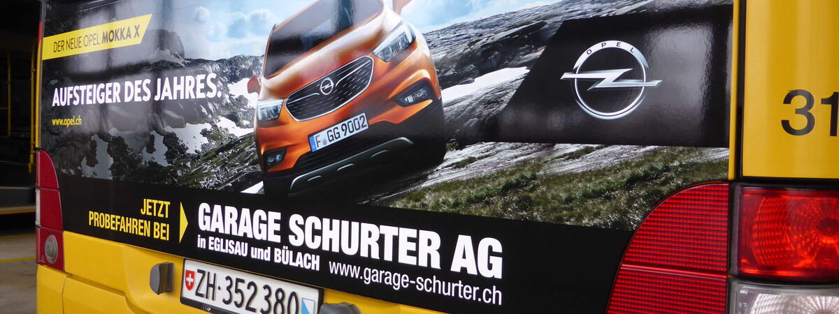 Bus-Heckscheiben-Werbung für Garage Schurter AG